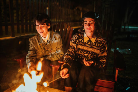 Making s'mores at a backyard bonfire