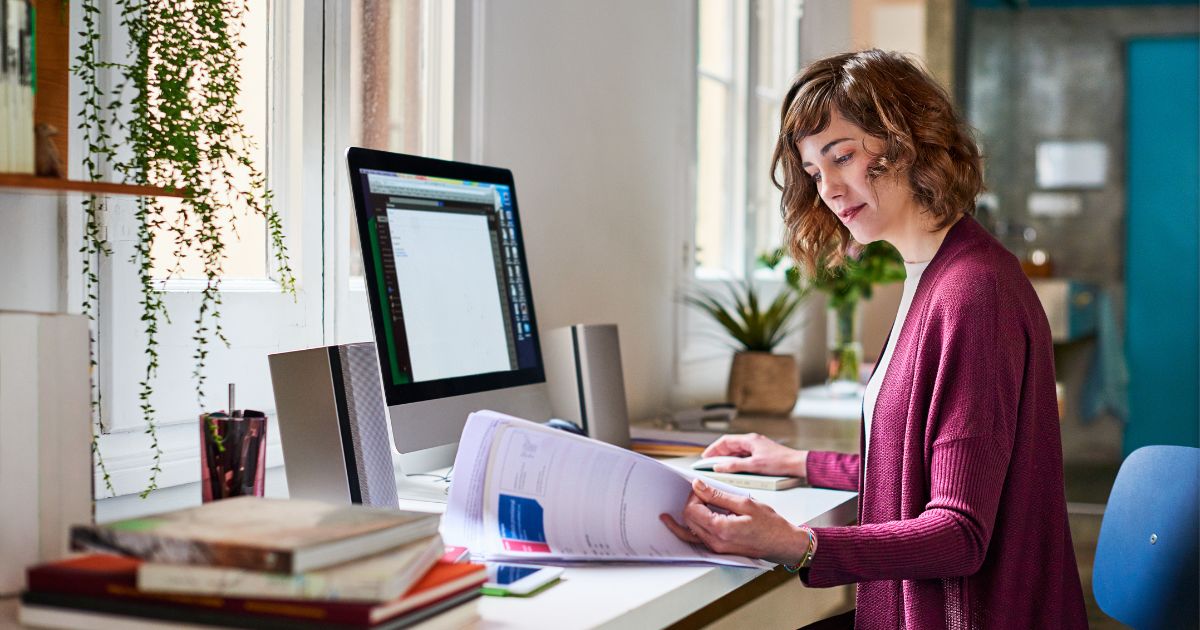 US expat doing her expat taxes at her desk.