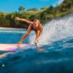 Woman surfing in Bali