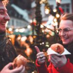 How to avoid homesickness is a challenging question for expats living outside the US. Pictured: two expats at a Christmas market.