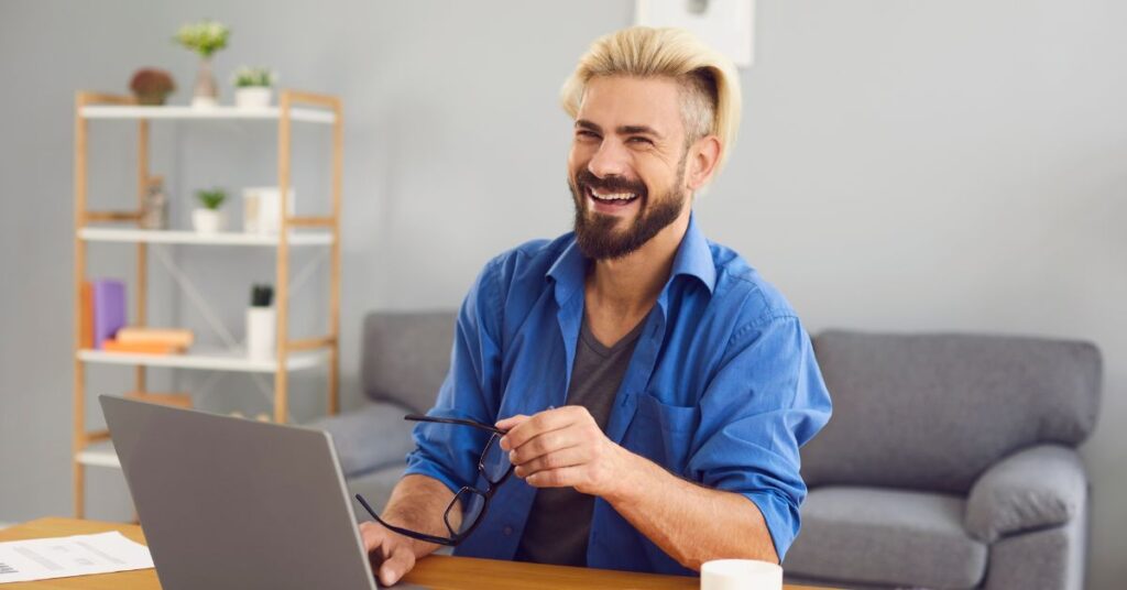 US expat taxes feel much less complicated when you partner with experts, like this expat man on his laptop.